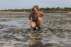 RBWG Project Manager Kandy Curran looking at a Lyngbya bloom smothering Roebuck Bay's seagrass meadows-min.JPG